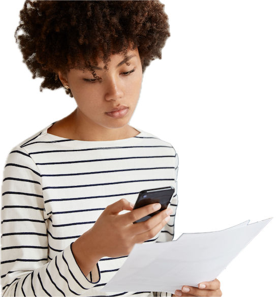 A lady messaging someone about her bills that she has in her hands